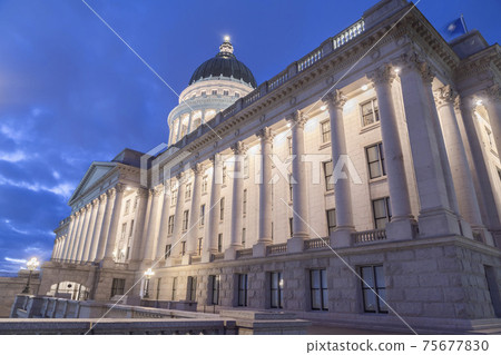 Facade of famous Utah State Capital Building glowing against vivid blue sky 75677830