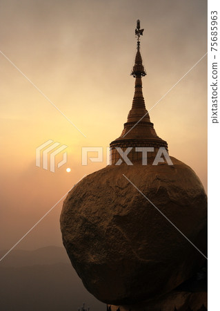 Orange sunset and golden rock in Myanmar Orange sunset and golden rock in Myanmar 75685963