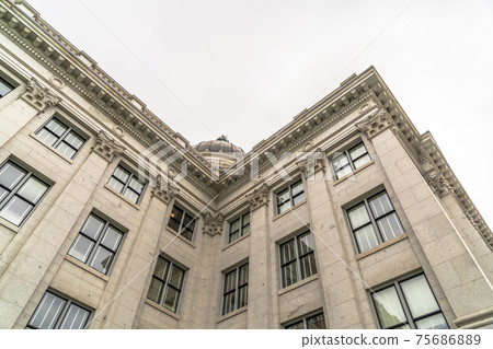 Utah State Capitol Building exterior with view of dome against overcast sky Utah State Capitol Building exterior with view of dome against overcast sky 75686889