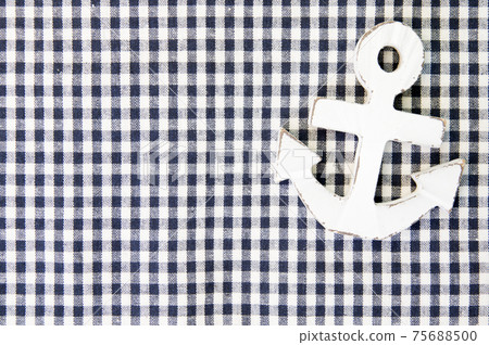A white wood anchor on fabric for background A white wood anchor on fabric for background 75688500