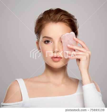 Beautiful face of young caucasian woman with perfect healthy skin, isolated. Pretty white model caring of face. Beauty treatment concept. Skin care concept. Beautiful face of young caucasian woman with perfect healthy skin, isolated. Pretty white model caring of face. Beauty treatment concept. Skin care concept. 75693139
