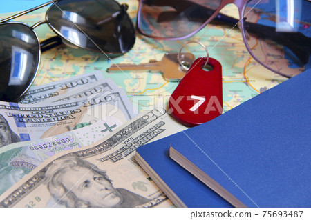 money passport and villa keys. Travel concept. Things collected for travel money passport and villa keys. Travel concept. Things collected for travel 75693487
