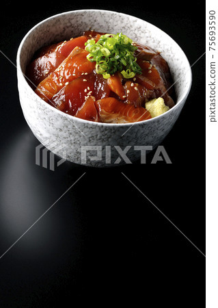 Two-color pickled rice bowl of tuna and salmon shot on a black background Two-color pickled rice bowl of tuna and salmon shot on a black background 75693590
