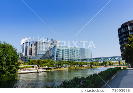 Strasbourg, France, August 2019. Nice view of the rear of the European Parliament building. The River Ill frames the modern metal and glass structure. 75695956