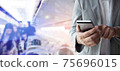 Businessman use smartphone for booking a flight ticket. 75696015