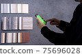 Materials Concept. Young man shopping matrials on mobile 75696028