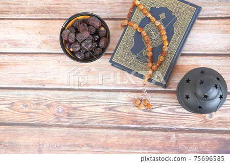 top view of date fruit , Holy book Quran and rosary on table, top view of date fruit , Holy book Quran and rosary on table, 75696585
