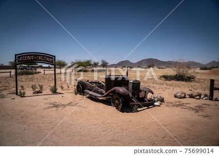 Vintage Car Wreck at Solitaire Town in Namibia Vintage Car Wreck at Solitaire Town in Namibia 75699014