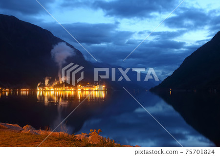 Night city Odda in the reflection of water. Norway 75701824
