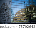 The new national stadium reflected in the building in front of you 75702642