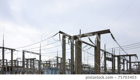 Power plant is a station of transformation. A lot of cables, poles and wires, transformers. Electro-energy. Power plant is a station of transformation. A lot of cables, poles and wires, transformers. Electro-energy. 75703403