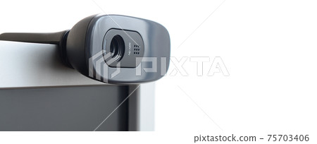 A modern web camera is installed on the body of a flat screen monitor. Device for video communication and recording of high quality video A modern web camera is installed on the body of a flat screen monitor. Device for video communication and recording of high quality video 75703406
