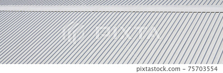 Metal gray roof with rhythmic parallel relief directions Metal gray roof with rhythmic parallel relief directions 75703554