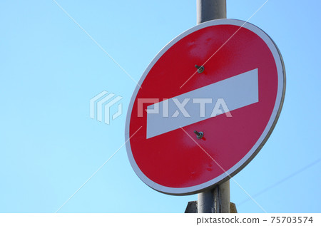 Road sign in the form of a white rectangle in a red circle. No entry 75703574
