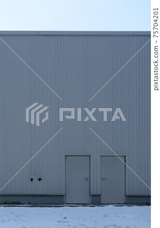 Texture of a high metal wall of an industrial building without windows 75704201