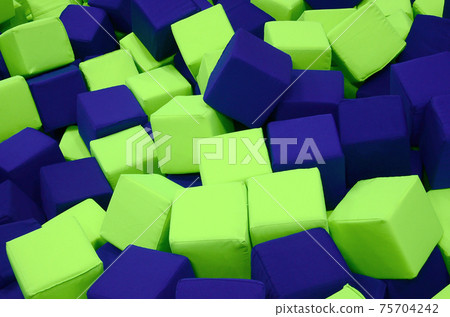 Many colorful soft blocks in a kids' ballpit at a playground 75704242