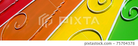 Metal texture of a piece of colored wall with a forged pattern Metal texture of a piece of colored wall with a forged pattern 75704378