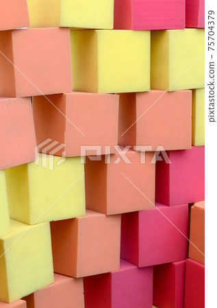 Wall of paralon soft cubes in dry pool, trampoline in the childrens center Wall of paralon soft cubes in dry pool, trampoline in the childrens center 75704379