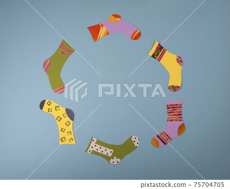 World Down Syndrome Day concept. Different socks made from paper on blue background. 75704705