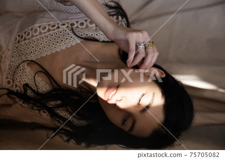 White young woman on white in shadow White young woman on white in shadow 75705082