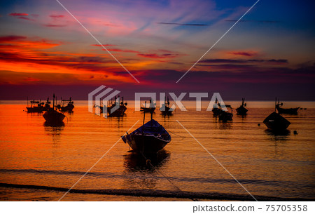Silhouette fishery boats in the sunset time. Silhouette fishery boats in the sunset time. 75705358