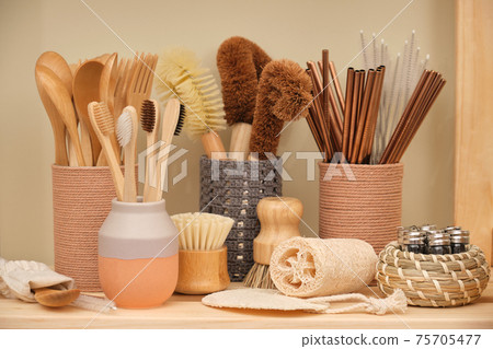 Collection of ecological household goods. Bamboo spoons, forks and toothbrushes. Eco-friendly coconut dishwashing brushes, round wooden dishwashing brushes, metal straws, loofah, natural shower 75705477