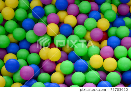 Swimming pool for fun and jumping in colored plastic balls Swimming pool for fun and jumping in colored plastic balls 75705620