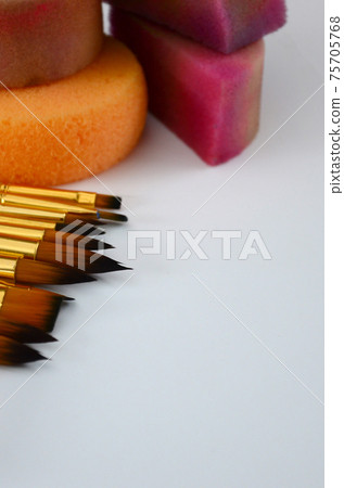 Color cosmetics, brushes and sponges for face painting on white background Color cosmetics, brushes and sponges for face painting on white background 75705768