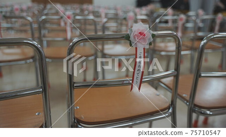 Small chairs lined up at the kindergarten graduation ceremony 75710547