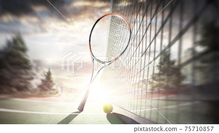 Tennis racket and ball on the outdoor tennis court. Sunset. Tennis. Sport Tennis racket and ball on the outdoor tennis court. Sunset. Tennis. Sport 75710857