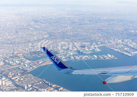 View from the window of a passenger plane, airplane, aircraft View from the window of a passenger plane, airplane, aircraft 75710909