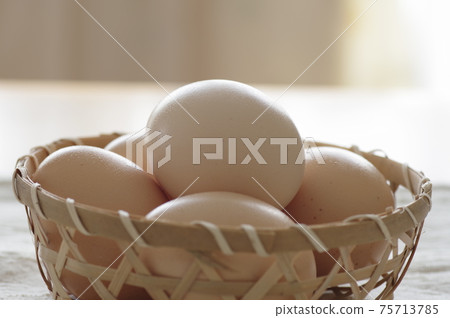 Eggs in a basket (chicken eggs) 75713785
