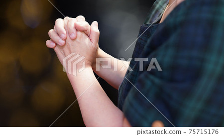 Praying hands Praying hands 75715176