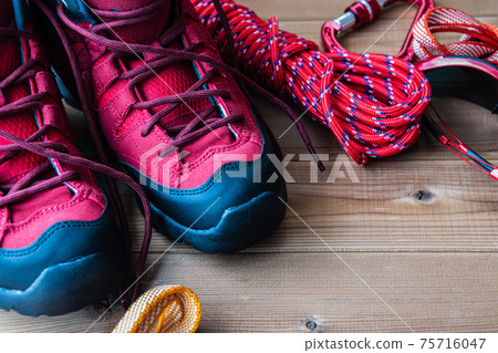 Red trekking shoes Mountaineering equipment Background material 75716047