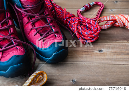Red trekking shoes Mountaineering equipment Background material 75716048