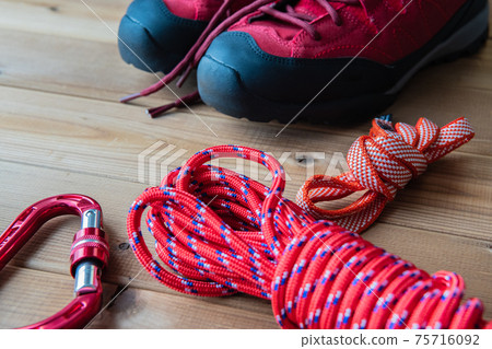 Red trekking shoes Mountaineering equipment Background material 75716092