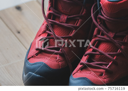 Red trekking shoes Mountaineering equipment Background material 75716119
