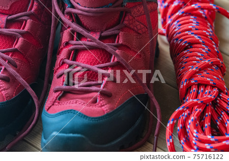 Red trekking shoes Mountaineering equipment Background material 75716122