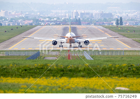 Passenger planes / airplanes / aircraft taking off from Asahikawa Airport 75716249