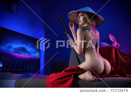 nude slender woman and asian hat with katana in hand image of samurai in neon room with tattoo on back 75718479