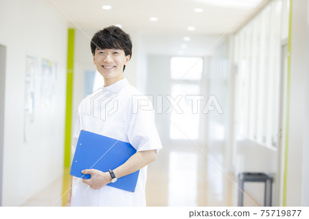 Male business medical caregiver in a white coat 75719877