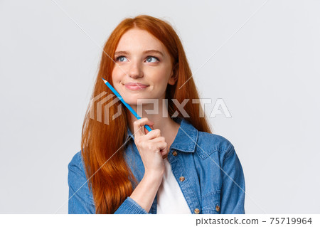Close-up portrait inspired, dreamy and talented cute redhead woman thinking what draw, holding colored pencil and smiling pleased, imaging artwork, designing over white background Close-up portrait inspired, dreamy and talented cute redhead woman thinking what draw, holding colored pencil and smiling pleased, imaging artwork, designing over white background 75719964