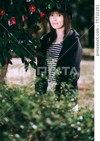 Female portrait surrounded by flowers Female portrait surrounded by flowers 75722201