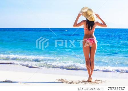 Woman on beach Woman on beach 75722787