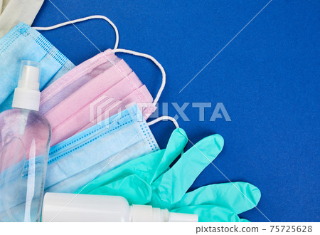 Flat lay of Coronavirus protection, medical protective masks, gloves, hand sanitizer Flat lay of Coronavirus protection, medical protective masks, gloves, hand sanitizer 75725628