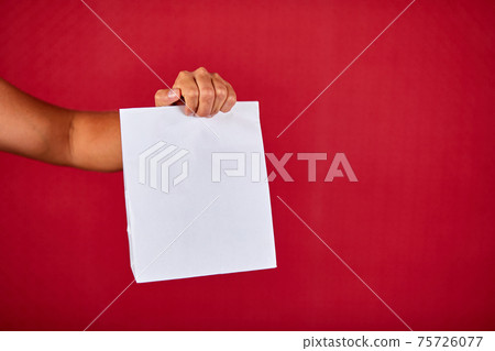 Closeup courier hand holding grocery paper bag, delivery service Closeup courier hand holding grocery paper bag, delivery service 75726077