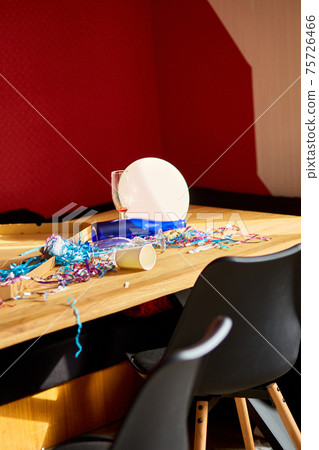 Messy wooden table at morning after party. 75726466