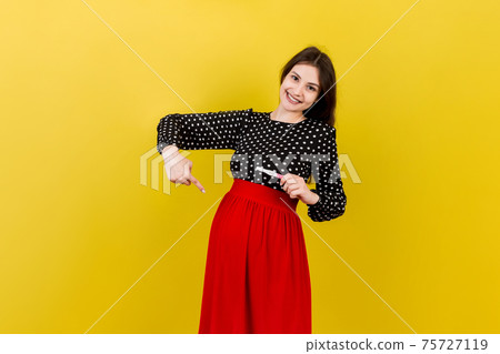 positive pregnancy test with two stripes against happy pregnant woman abdomen at Colored background. Future mother in gray dress. Pregnancy surprise. Copy space 75727119