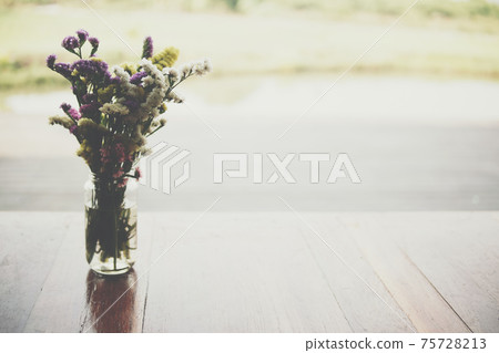 flower bouquet in glass vase at patio flower bouquet in glass vase at patio 75728213