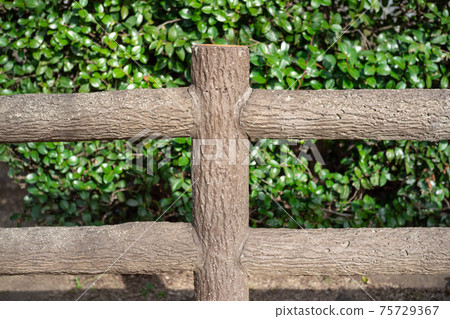 The installed concrete artificial wooden fence from the front The installed concrete artificial wooden fence from the front 75729367